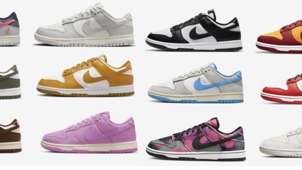 Side view of 12 multi-colored Nike Dunk Low sneakers.